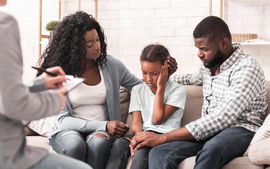 Parents and child in mediation session